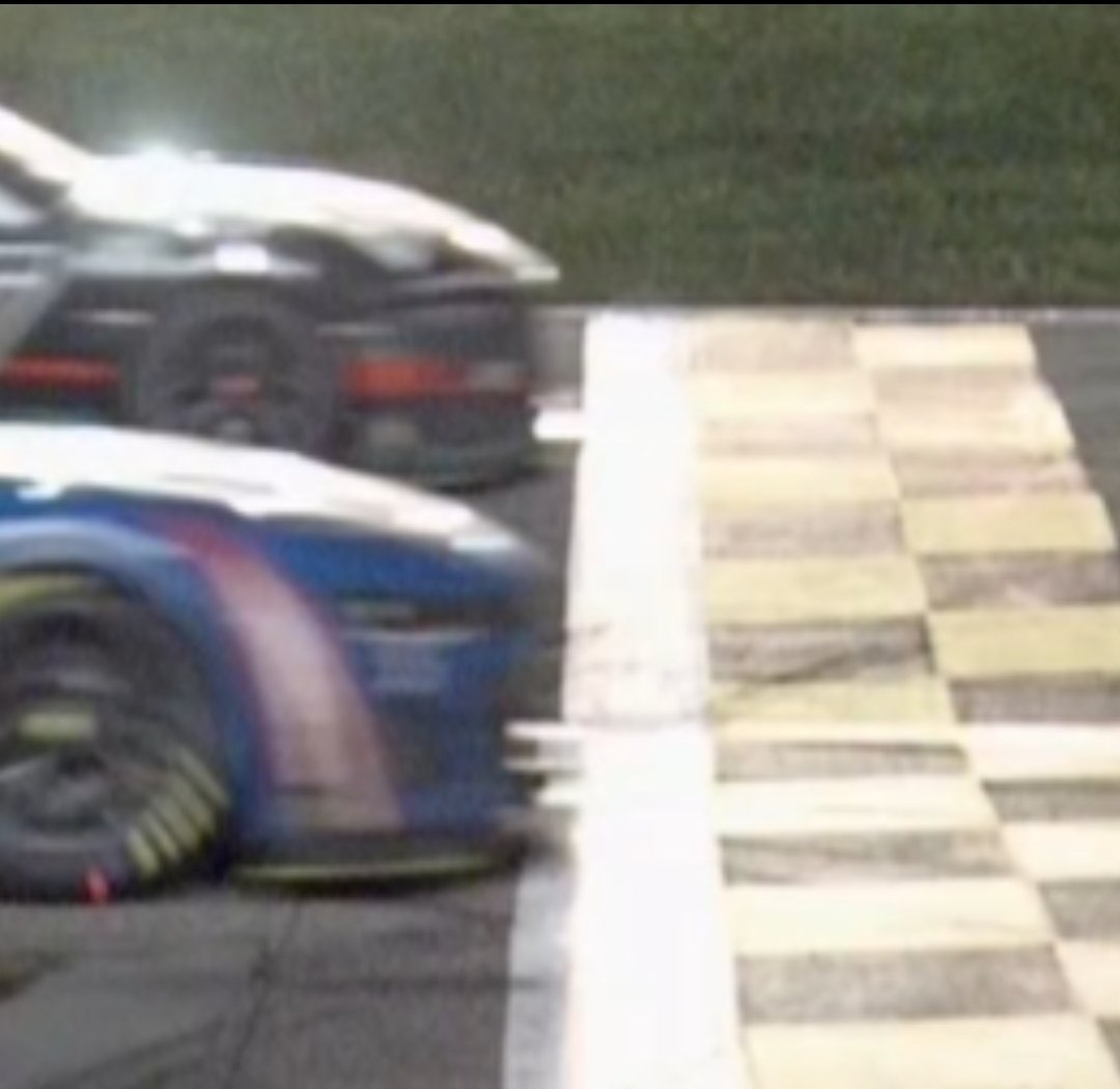 That finish was so close, even the scoring system couldn't accurately call it. Photo finish shows Larson by an inch. Crazy