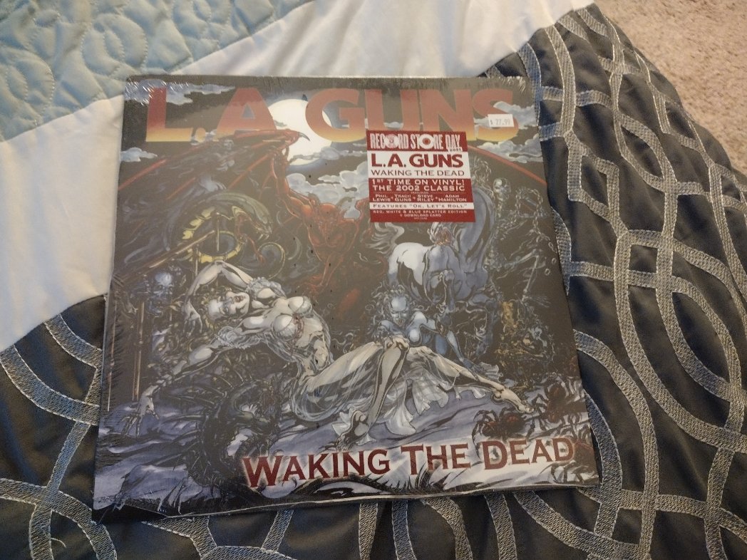 I picked up an old Record Store Day release of LA Guns' Waking The Dead. I love the comic book style artwork.