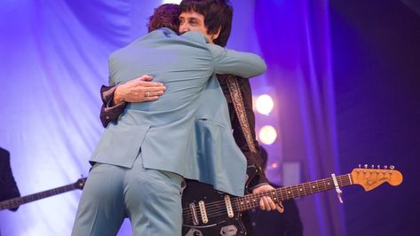 Oh to be alex turner hugging johnny marr