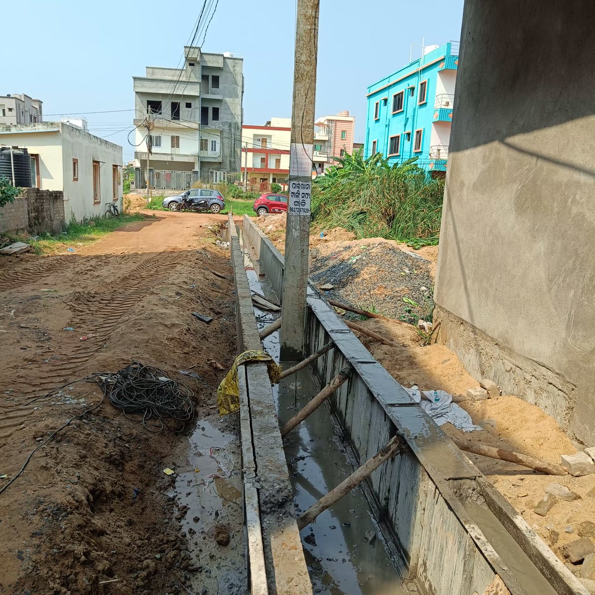 This is how BMC, bbsr and Tpcodl, executing drain and electrification work, in Bharat villa, lane no-33,Rudrapur, bhubaneswar, odisha.