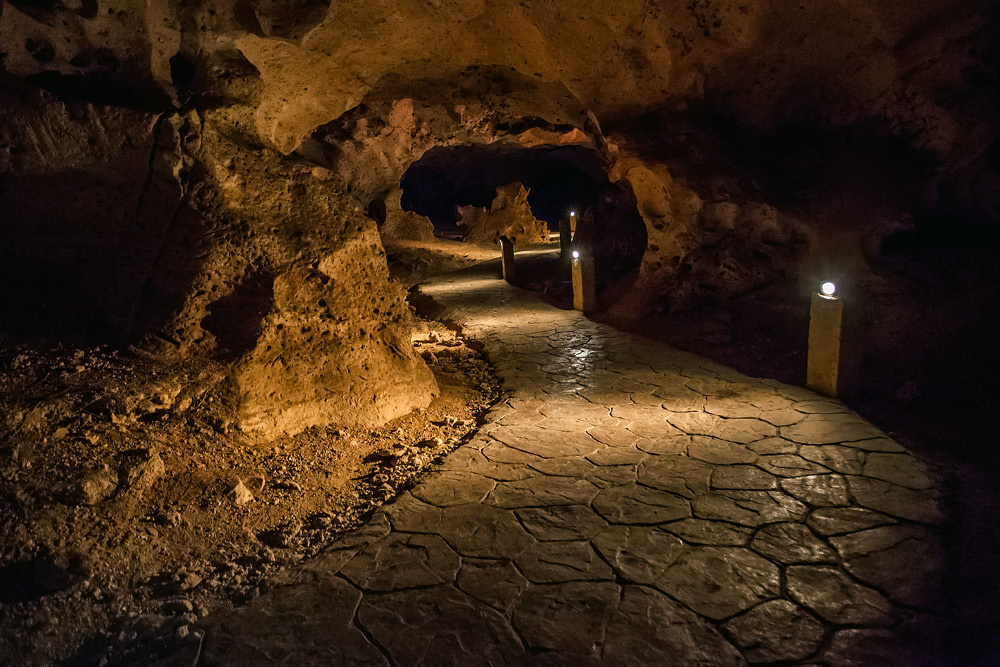 Sometimes, the world’s beauty is better witnessed underground. At the Green Grotto Caves, you can explore seemingly endless chambers as you make your way toward a subterranean lake.