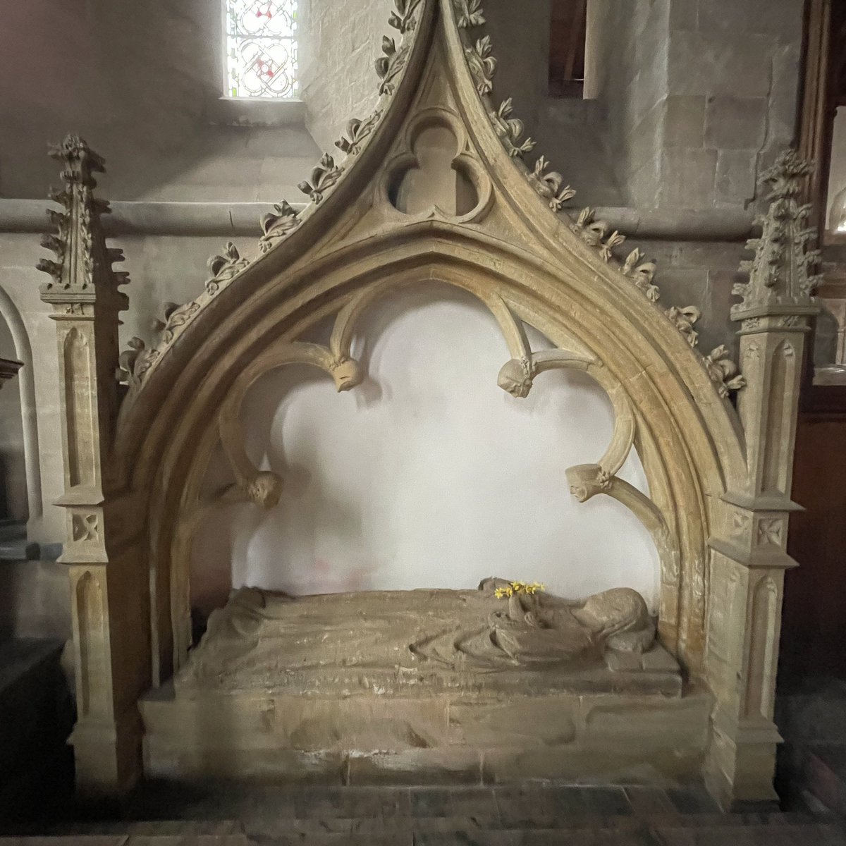 We don’t know for certain who she is, possibly one of the Everard family, but someone had put a spray of flowers into her hands when I visited St George’s, Dunster, Somerset a couple of weeks ago stone female, effigy with canopy #MonumentsMonday