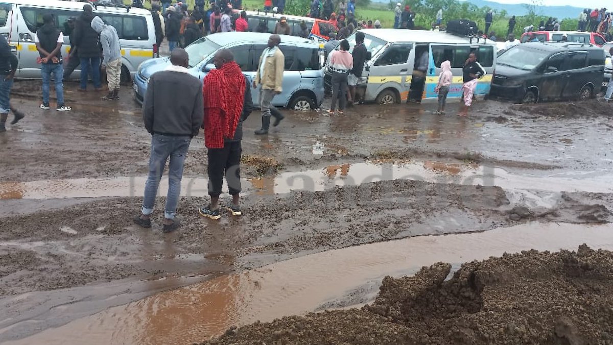 Hundreds of commuters and truckers stuck between Suswa and Duka Moja along Narok highway after floods swept sand onto the busy highway Photos by George Njunge