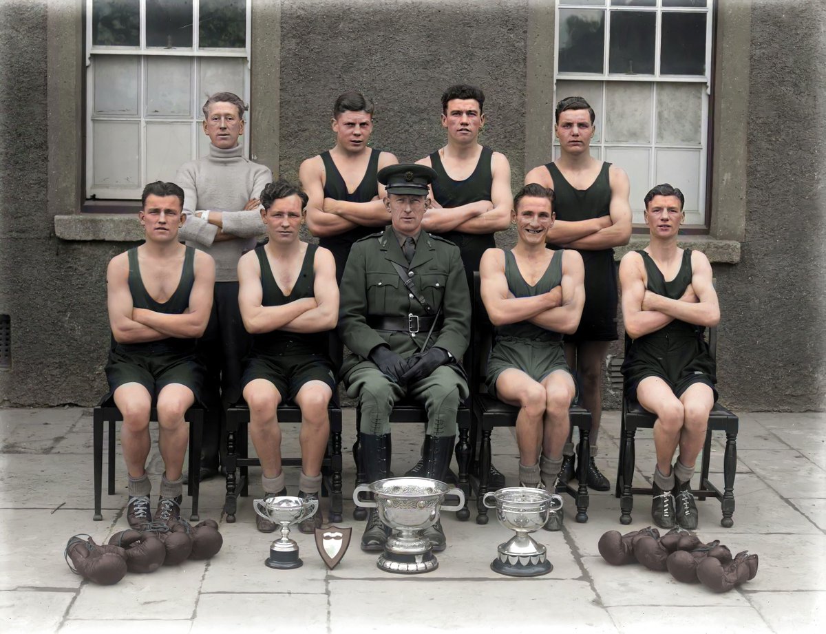 c1944, Champions of the Ring 🥊 Waterford Boxing Club's award-winning army boxing team poses at the Infantry Barracks. A fine display of silverware! Must have been a cold day in Feb as they brace, yet their expressions radiate warmth & pride. 📷 NLI #Waterford #History