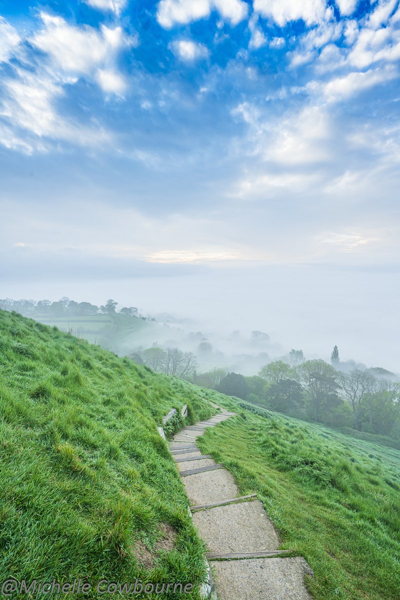 It is a special thing to climb up Glastonbury Tor in the dense fog and as you get to the top it clears so that you can see for miles around. Trees peeping through the mist as you listen to the birdsong. This is the view from the top looking down towards the Somerset levels.