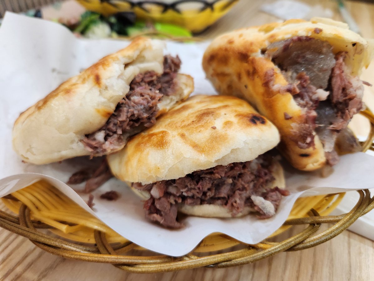 LetChinese's tweet image. #Baoding&apos;s must-try delicacy is the Donkey #burger! 🥙 Juicy donkey meat wrapped in a crispy pastry. Experience the unique flavors of this local specialty while wandering through Baoding&apos;s bustling streets. Which one of these two photos do you think is the burger I made myself?😁