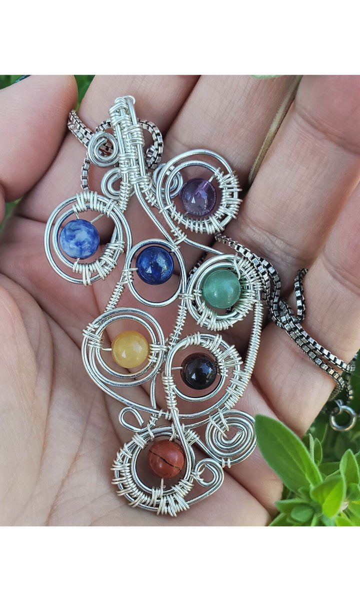 Whether or not you believe in mysticism, Yvonne Shisley's 'Chakra Grid' #pendant is as intricate as it is mesmerizing. 
#WireWrap #HandmadeJewelry