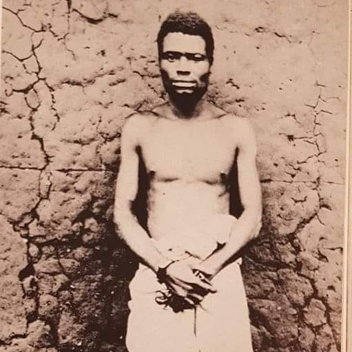 Hanged by the British, at exactly 8 a.m, on June 28,1899. Ologbosere, chief of the Benin Kingdom and warrior fought a guerrilla war for 2 years. To the British he was treacherous and barbaric, but to many Edo he was symbol of resistance against the invaders. Photographed just…