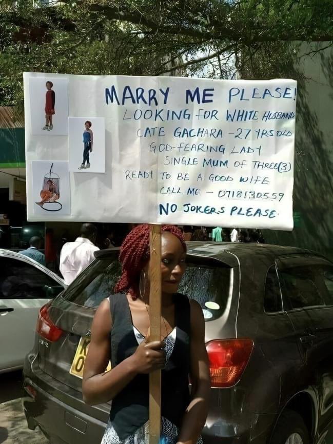 'Ready to be a good wife,' says 27-year-old Catherine Gachara on her placard searching for a husband.

The mother of three says she is looking for a white man who will marry her.