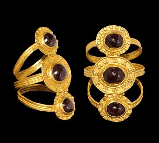 This Pre-Viking Triple Bezel Gold Ring from the 3rd Century is adorned with dark purplish garnets, known as almandine, which add a touch of color and sophistication to the piece. The design of the mount, with three shoulders merging, is distinctly Scandinavian, reflecting the…