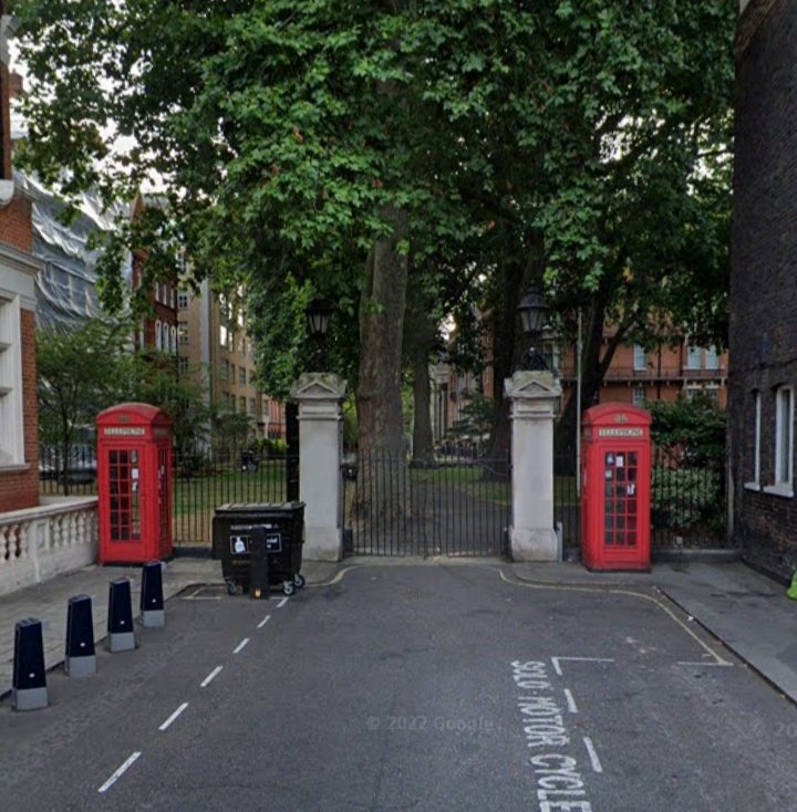 Mount Street Gardens, once Mount Fields, a fortification during the English Civil War, containing a Canary Island date palm tree. Outside grade II listed K2 telephone kiosks and the Portland stone gates with lamps by the entrance of South Audley Street.