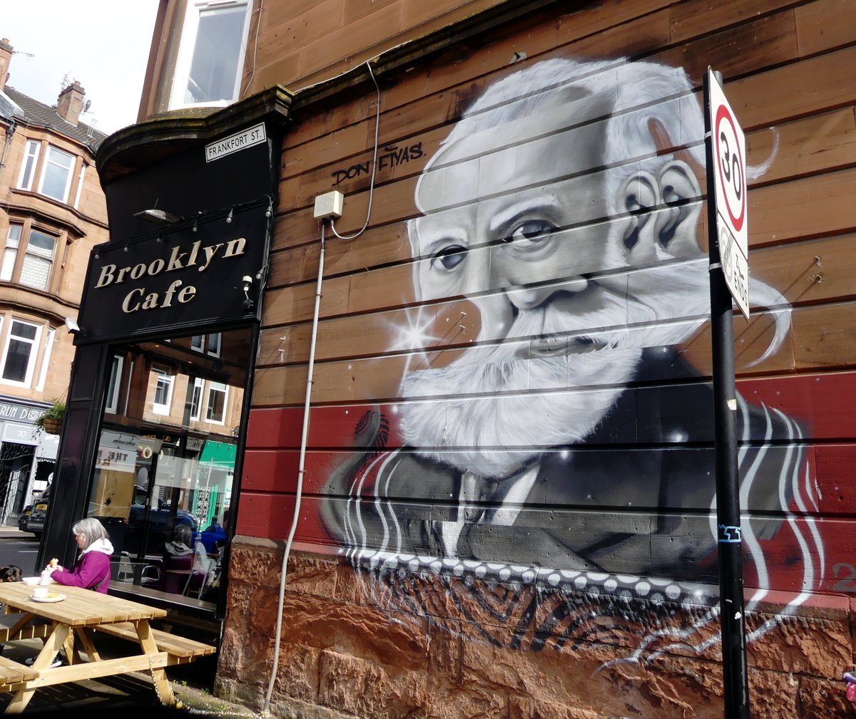 New Southside mural celebrating Alexander Graham Bell, inventor of the first telephone. As students of technology know, the first telephone was a failure; Bell's breakthrough came only when he invented a second telephone and used it to communicate with the first. [ISIHAC/trad.]