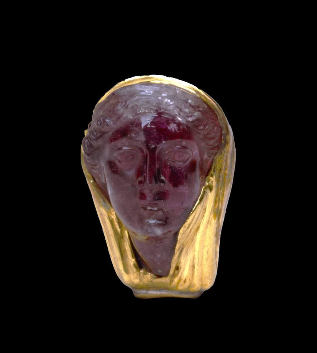 Amethyst head wrapped in gold, Egypt, 300 BC. This head of a woman believed to be Arsinoë II, dates from around 300 BC, and portrays the Queen with a golden veil draped over the back of her head, with her curled hair peaking through, typical of Greek dress of the time. Her face…