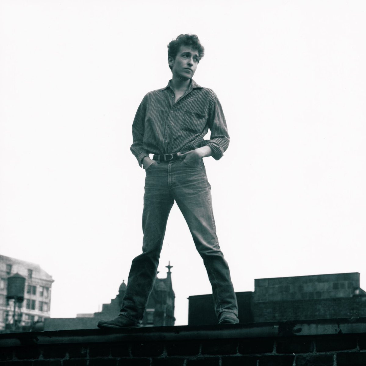 Bob Dylan poses with his hands in his pockets, NYC, 1963. 📸: Ralph Baxter. #BobDylan #Dylan