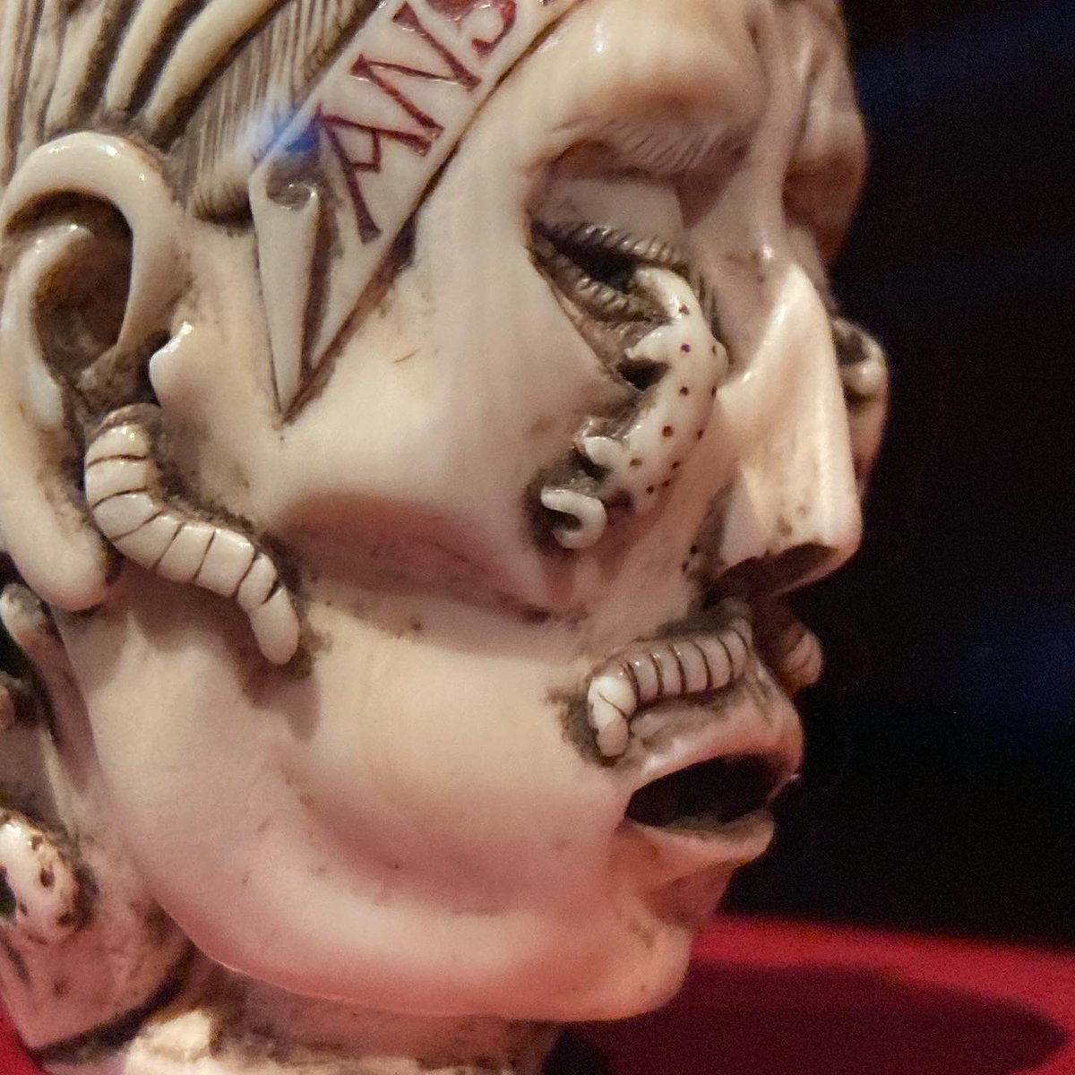 Memento mori netsuke from Japan showing bodily decay. Netsuke are adornments for kimono sashes, or toggles to hold boxes shut. They often take the form of elaborately carved figures or animals. They could be ivory, like this one, wood or porcelain. In the science museum, London