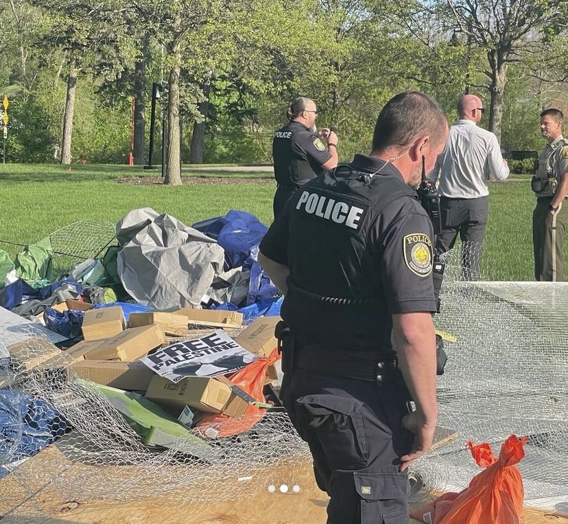 IOWA CITY: A pro Palestine encampment at University Of Iowa launched at 7am, with around 25 campers and 20 tents. At 730am UIPD came and said campers has 30minutes to disperse, 15 minutes later the cops moved in on the protest and tore down tents with people in them.