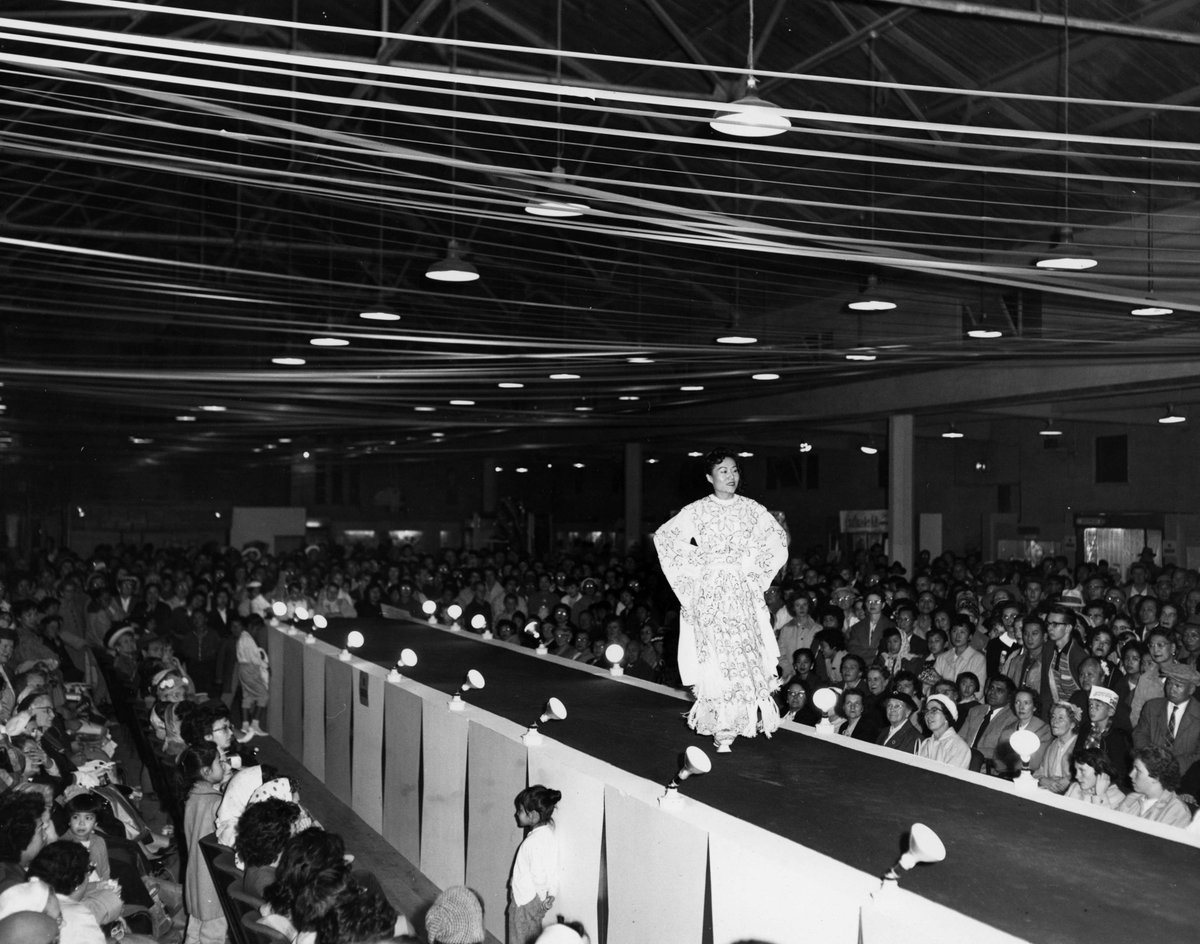 In honour of the Met Gala this evening tell us about your best dressed moment in Vancouver. Image: Model walking on fashion runway in front of audience. Dates: 1959 Ref. code: AM1563-F22-: 2010-095.26 ow.ly/rRMI50RpzmJ #metgala #Vancouverstyle