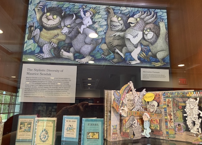 A new, exciting exhibition in Olin Library, 'Re-Drawn' presents materials from Special Collections curated by @samfox_MFA_IVC students.  Pictured are 'Black Children's Books' and 'The Stylistic Diversity of Maurice Sendak.'