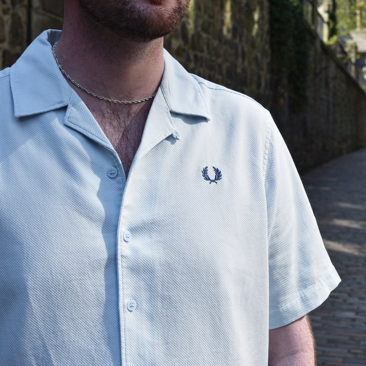 Seasonal colours of the popular Fred Perry M7774 Pique Texture Revere Collar Shirt have arrived in for the summer, going hand in hand with beer gardens. Seen here in ‘Light Ice’ and available now!