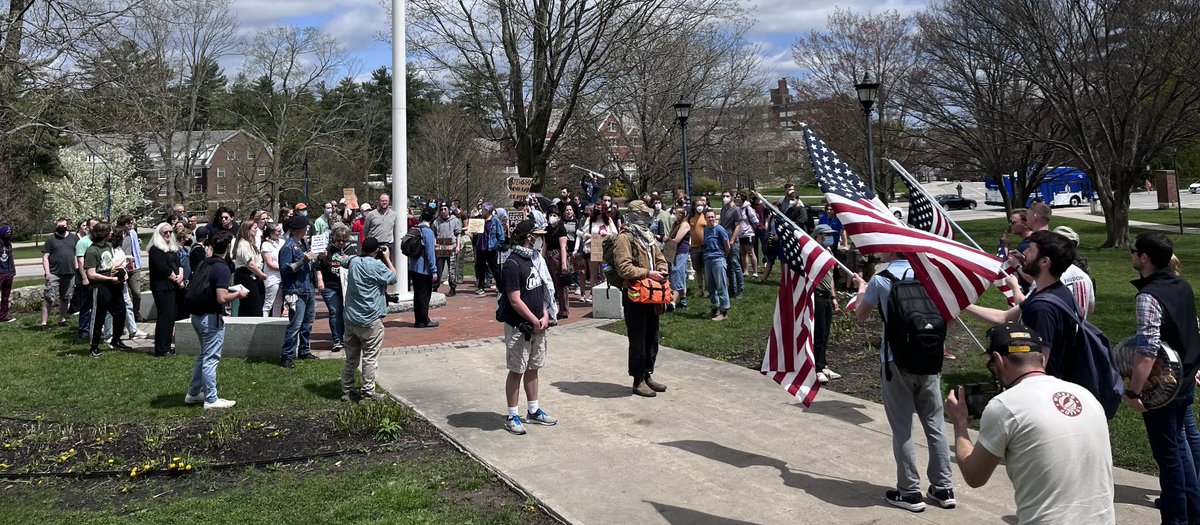 A group of counter protesters with American flags are on hand as well -->

@UofNH @NHGOP @NHDems
