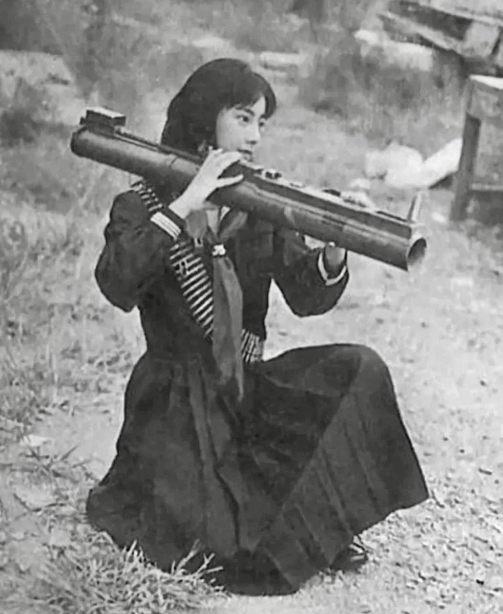 Fusako Shigenobu, leader of the Japanese Red Army, trains with a grenade launcher, 1972, Lebanon.