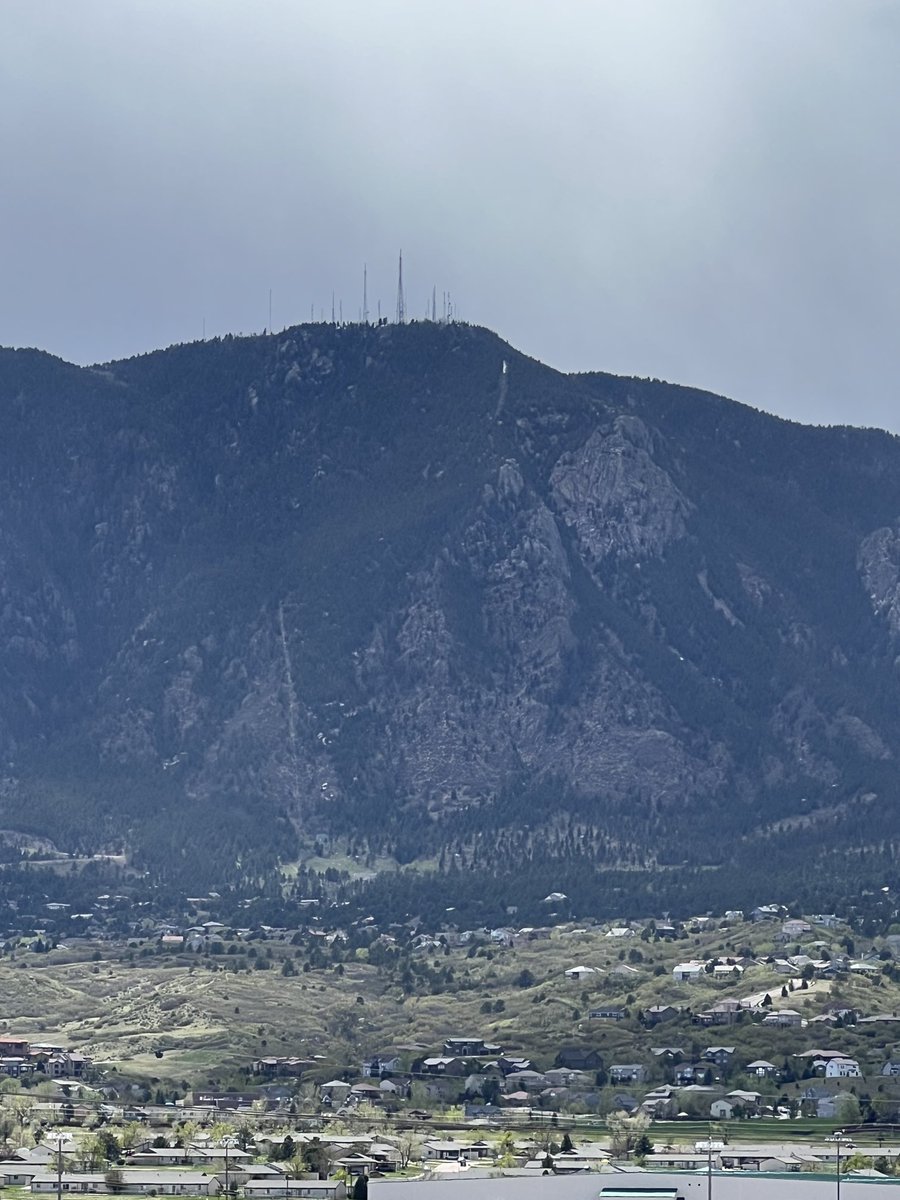 High winds today in Colorado Springs, and smoke from a fire. That’s NORAD mountain under those transmission towers.