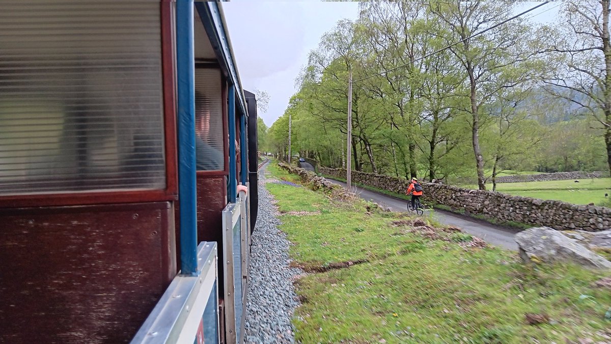 At one point, we (Esk and St Egwin) were raced by a cyclist from Beckfoot to Dalegarth. 
He was deliberately keeping level to watch the train.

I might have to try this out one day.