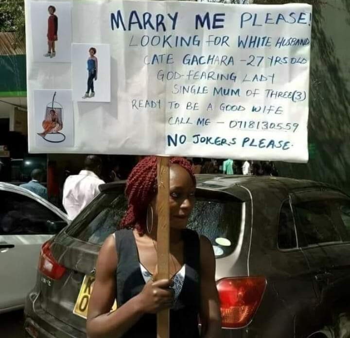 'Ready to be a good wife,' says 27-year-old Catherine Gachara on her placard searching for a husband.

The single mother of three says she is looking for a white man who will marry her.