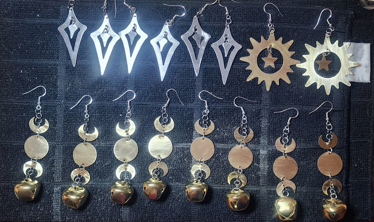 New earring design along with a design restock!  
#handmade #handmademetaljewelry #artisan #artisanhandmade #artisanjewelry #handmaderarrings #earrings #jewelry #moon #occult #witch #sun #brass #aluminum #metaljewelry #bell