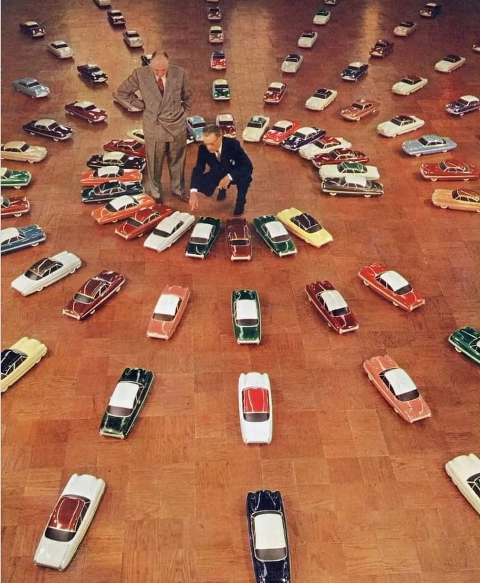 Ford executives selecting their 1953 automobile colors from 76 different scale models of them.