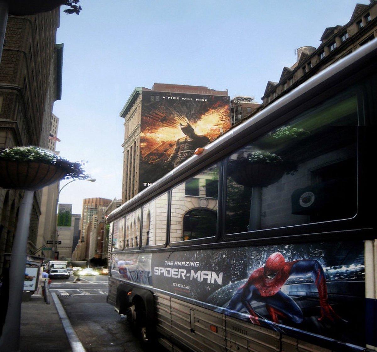 The Amazing Spider-Man (2012) Bus banner with A Dark Knight Rises billboard in the background