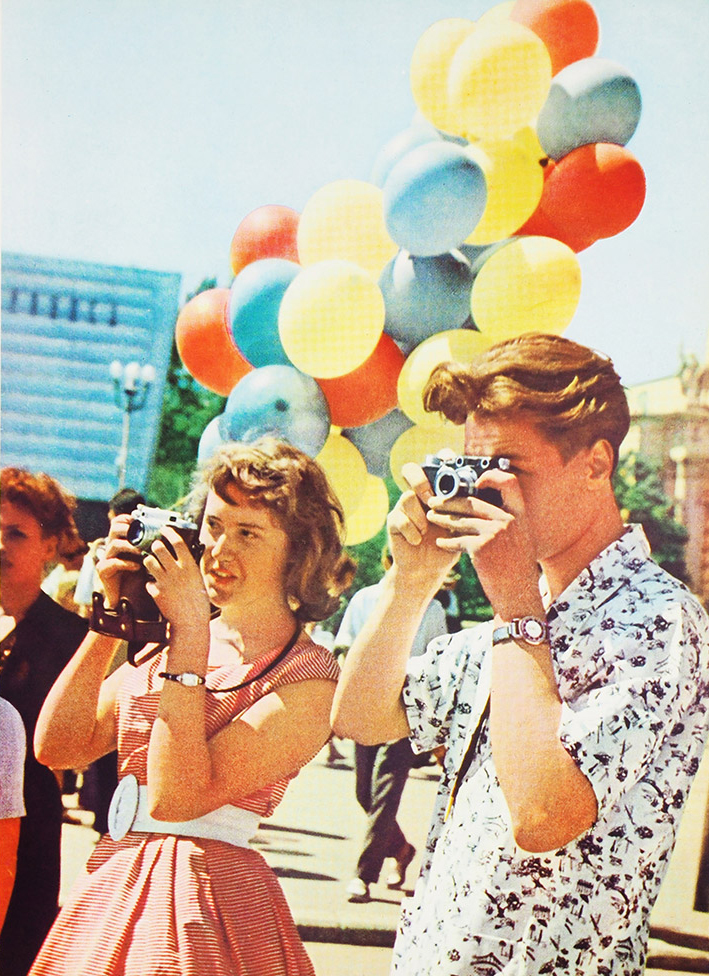 'Thousands of cameras take back memories of Moscow...' Photo and caption from a 1963 Moscow photobook.