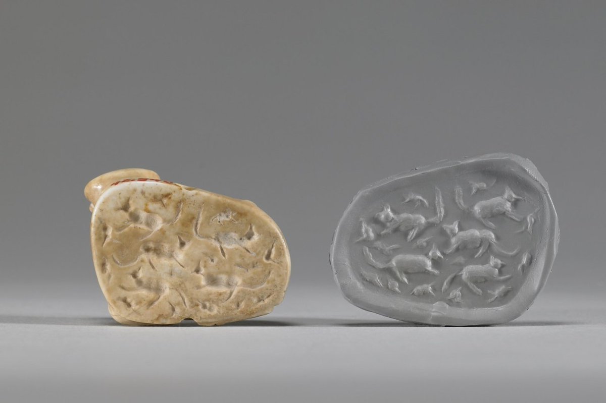 A Mesopotamian stamp seal, 3200-2900 BC. The upper portion is shaped like a reclining calf, but the stamp itself delightfully portrays a collection of cats. Collection & Credit: Walters Art Museum.
