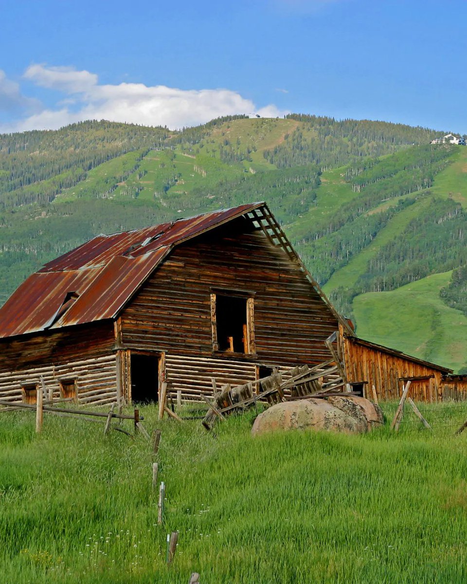 Have you visited this iconic landmark? 🏔️ Nestled against the majestic Rockies, the Steamboat Springs Barn, fondly dubbed the 'More Barn,' is a cherished emblem of our town's history and scenic allure. 
⁠
#steamboatsprings #morebarn #mountaincharm #historiclandmark