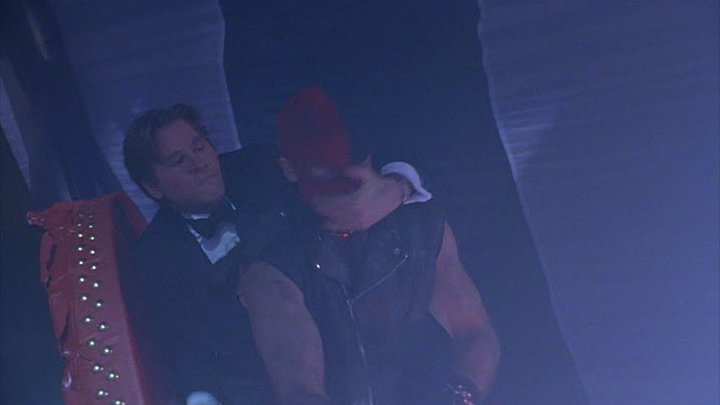 One of the more subtle changes in BATMAN FOREVER: 30th ANNIVERSARY EDITION is the removal of a 'neck snap' sound from the circus fight. In the script, Bruce sucker punches a thug. In the movie, it looks a little more violent. A snapping neck sound was added which irked the BBFC.