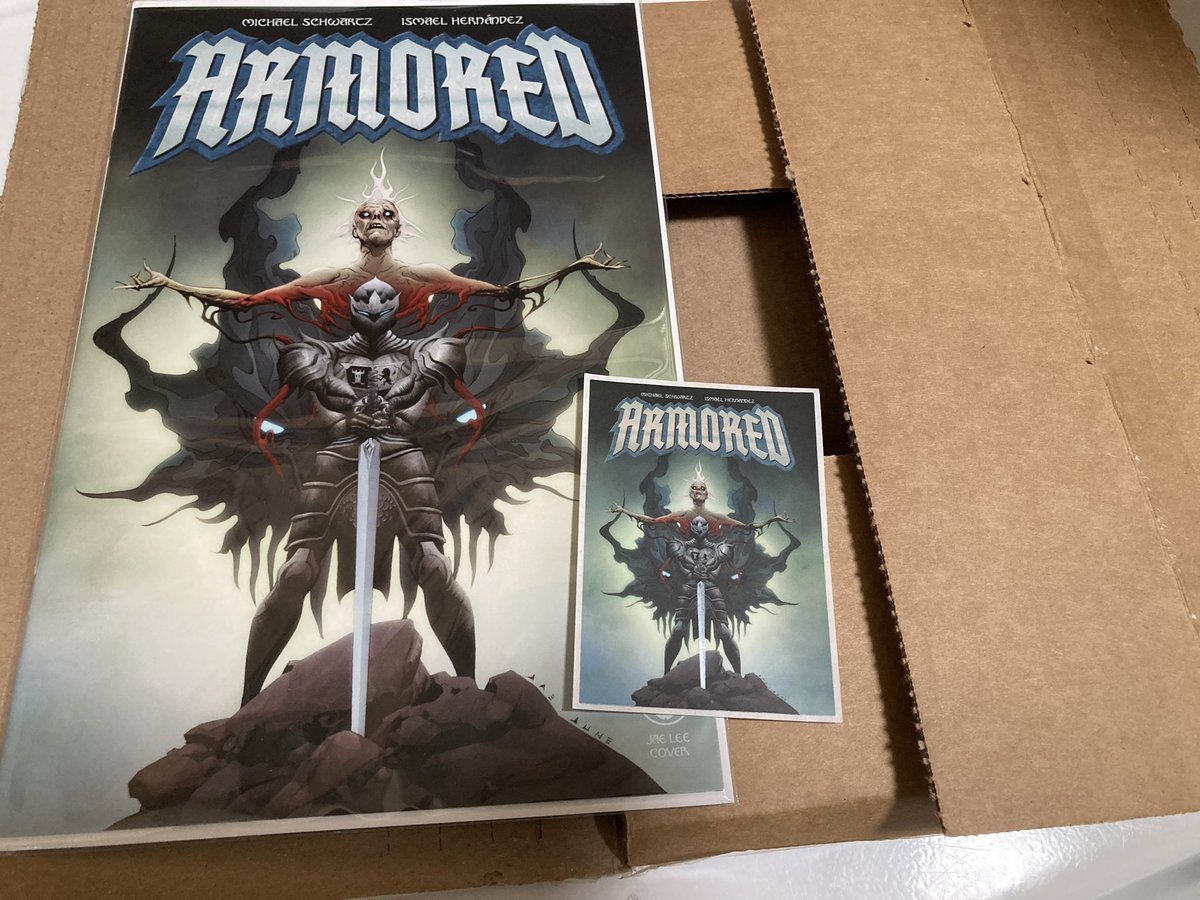WIZARDS co-host, @TheMikeSchwartz created a cool comic called ARMORED being published by @clover_press and as a Kickstarter backer, co-host, Adam got a copy with an awesome Jae Lee variant cover, plus a bonus sticker. Get a copy on May 15th at your LCS. Tell ‘em WIZARDS sent ya!