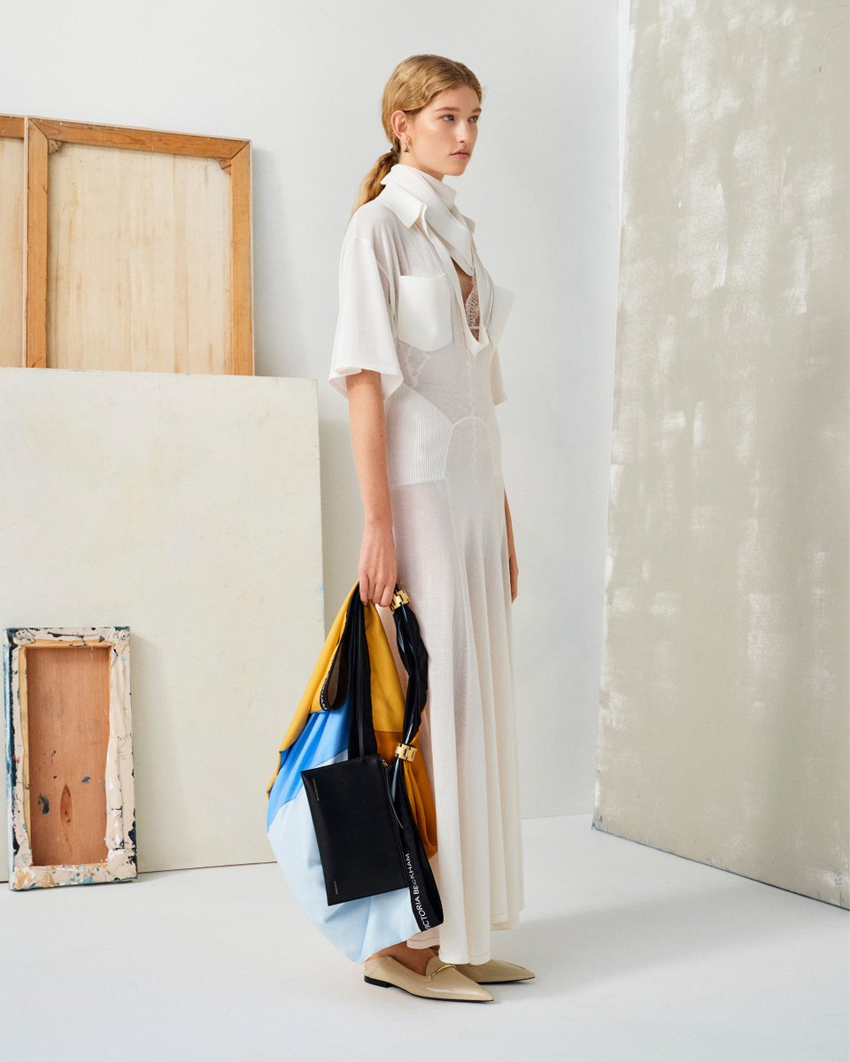 A recurring motif for the new season, matching neckerchiefs in cinematic hues are styled with 1930s-inspired dresses or transformed into foulard bags. Discover new season dresses >> victoriabeckham.visitlink.me/APz-GF #VBPAW24