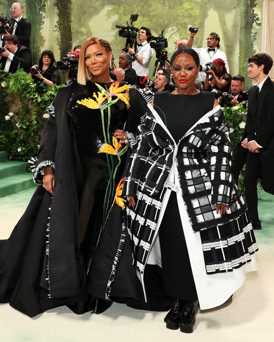 … queen latifah & eboni … queen latifah and eboni nichols wear custom thom browne for the 2024 met gala. queen latifah wears a gathered coat in black peau de soie with raffia and bugle bead fray tipping over a square shoulder dress embroidered with black sequins and birds of…