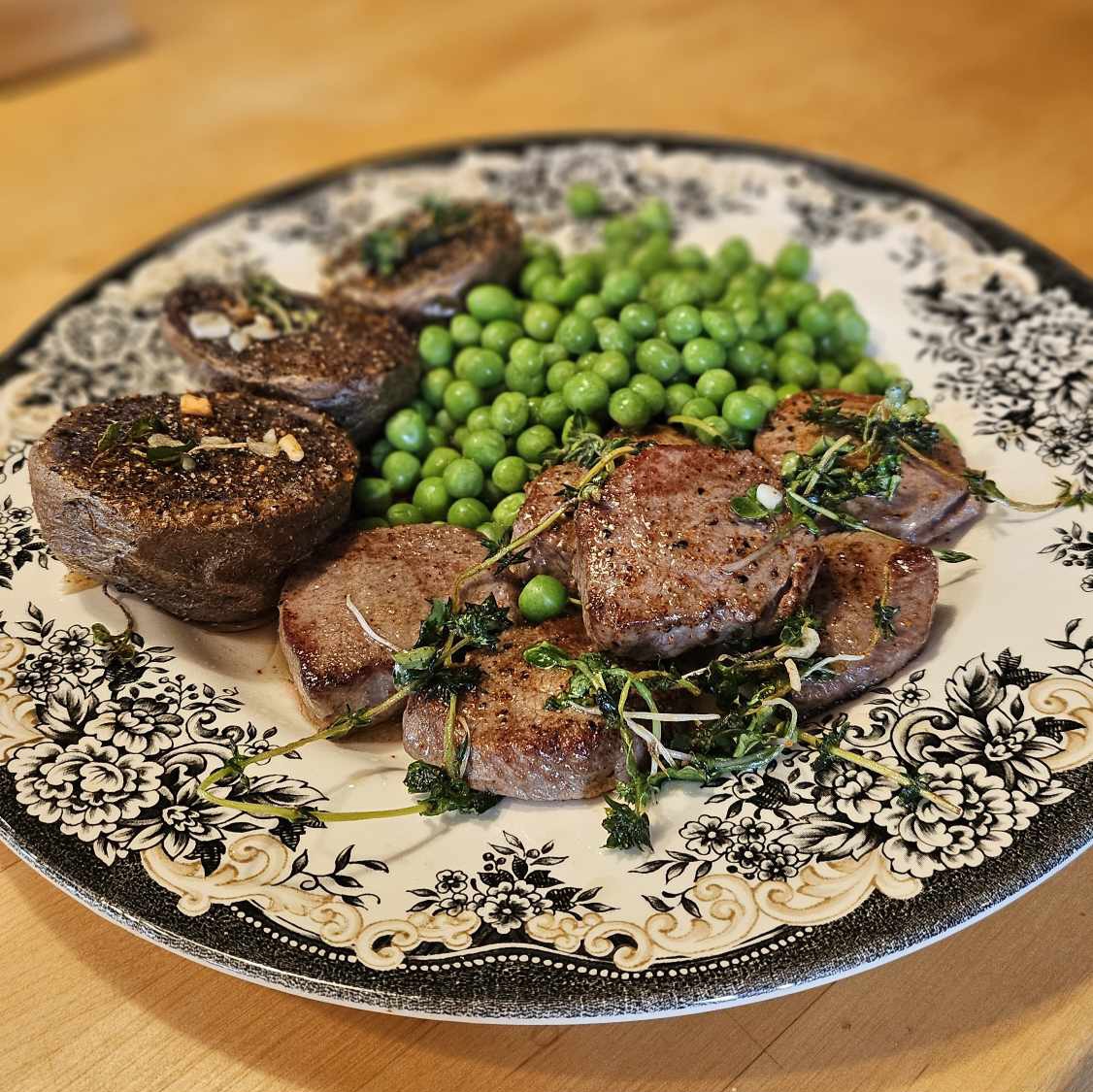 Venison backstrap medallions with radish microgreens and thyme, served beside the last of last year's frozen shelling peas and roasted purple potatoes. Yard to table; everything came from within 50 yards of the kitchen. 

#foodie #homesteading #gardening #hunting