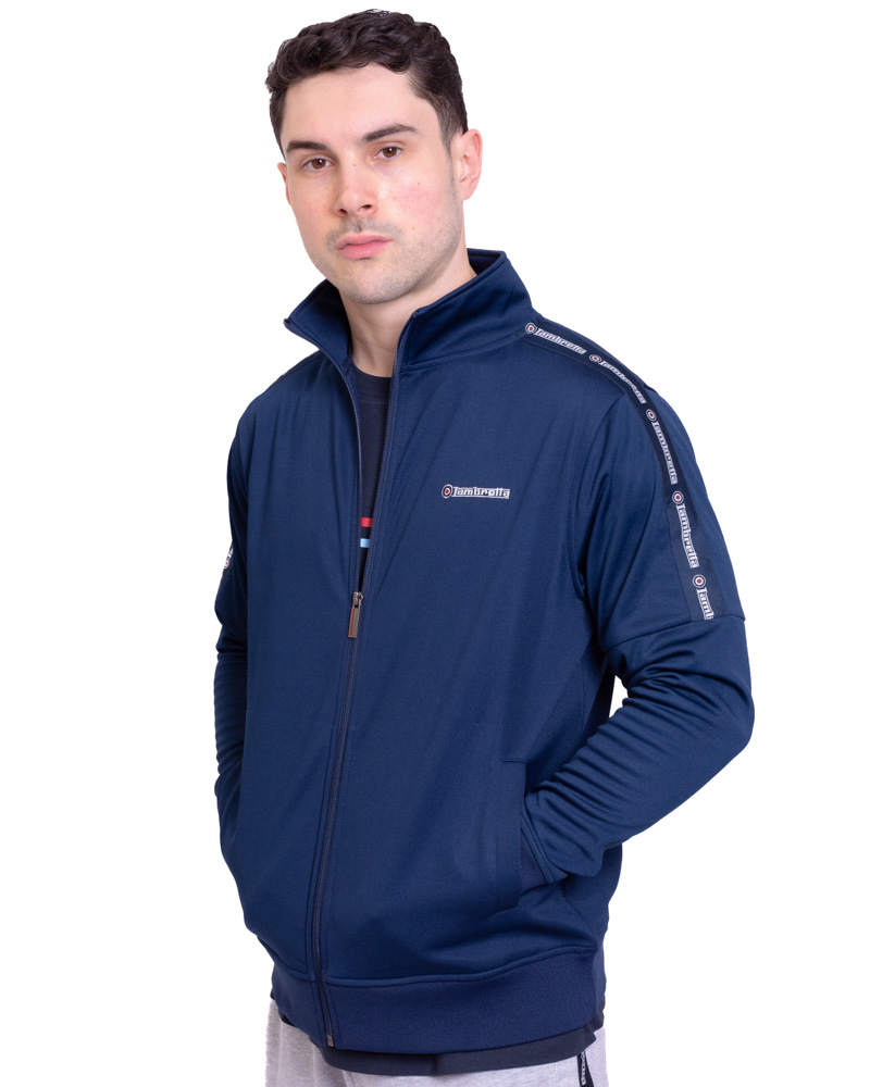 From #Lambretta a versatile jacket that pairs effortlessly with both casual and athleisure outfits, features branded taping over the shoulders and down the arms. Available in Black & Navy quadropheniaalley.com/search?q=ss110…