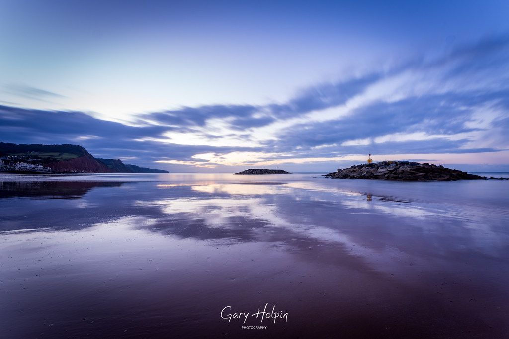 Morning! This week is reflections week, and next is some beautiful blue hour tones reflected in #Sidmouth beach at dawn... 👇 #dailyphotos #tuesdayvibe #Devon #thephotohour #stormhour