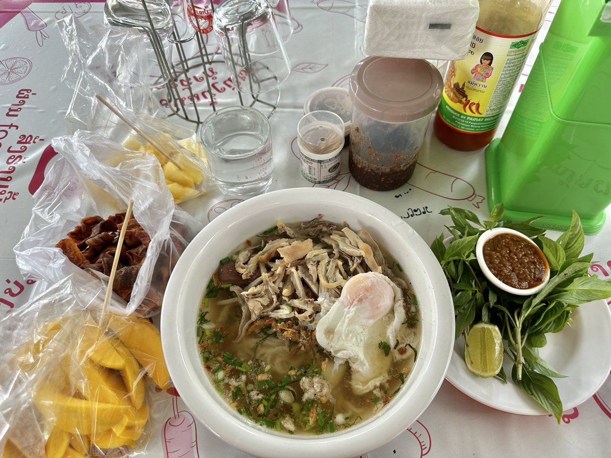 khao piek gai and some mangoes and pineapple and banana chips from my neighborhood fruit vendor