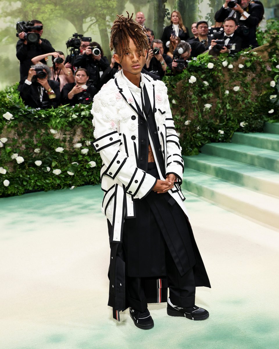 … jaden … jaden smith wears a custom thom browne all-in-one modular coat in white denim, black wool mohair and calvary twill with black grosgrain tipping and hand-pleated pink and white dahlia appliques over a quilted shirt in white oxford and trousers in black wool mohair with…