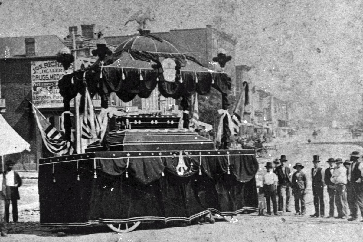 Andrew Johnson's funeral car/hearse. It's a sizeable means of conveyance to the cemetery. I marvel at the comparison between it and the men standing to its right. (AJ NHS.)