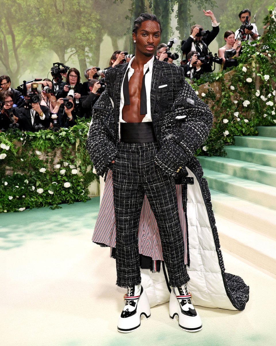 … alton … alton mason wears a custom thom browne oversized tailcoat in black deconstructed denim tweed with grosgrain tipping and hand-beaded leave appliques over a reconstructed jacket and pleated skirt in black plaid ribbon tweed with silk faille tipping and appliqué bullion…