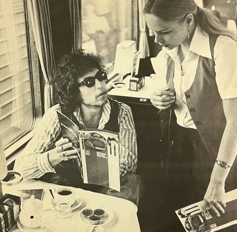 Bob Dylan asks the waiter for recommendations, Europe, ca. 1978. 📸: Morgan Renard. #BobDylan #Dylan