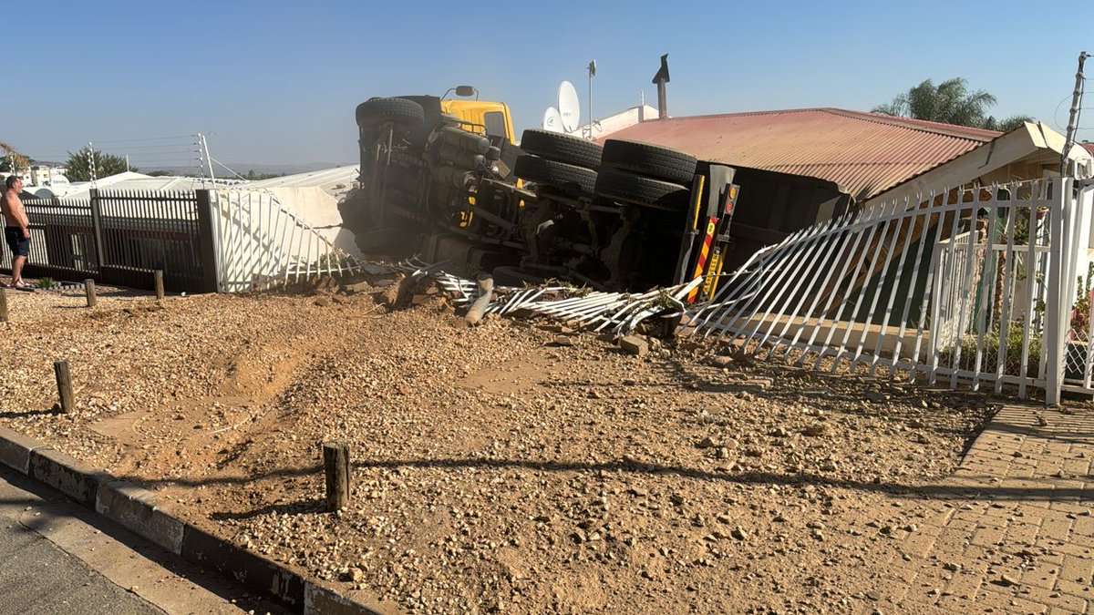 JUST IN: The driver of a tipper truck reportedly lost control of the vehicle in Gamsa Street in Windhoek's Kleine Kuppe. According to those on the scene, the driver is still trapped inside the cab. Photo: Contributed #NamSunNews