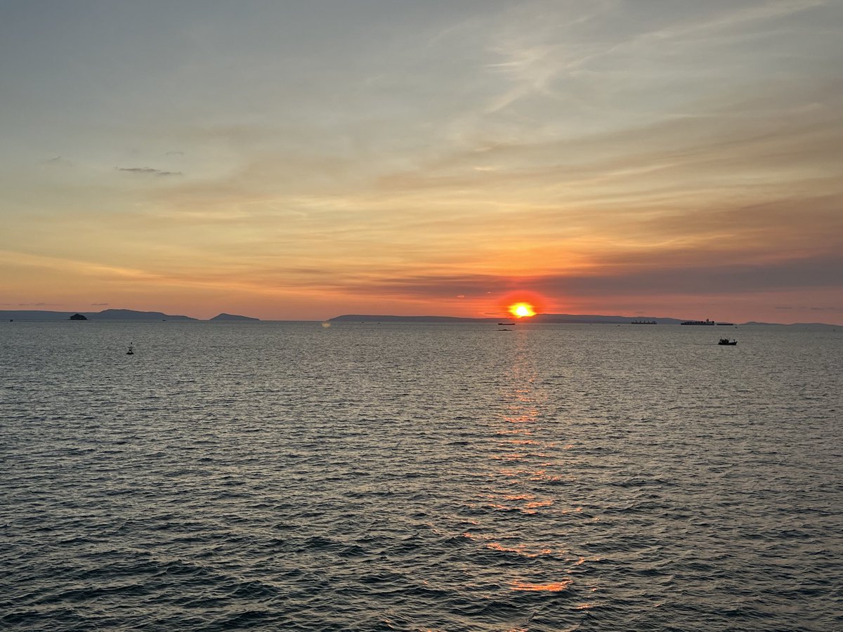 davegamblejr's tweet photo. Sun setting over the small island of Kah Rong into the Gulf of Thailand.  View from balcony aboard Seabourn Sojourn in port Sihanoukville, Cambodia.  ⁦@spann⁩ https://t.co/U2R0XX0jSo