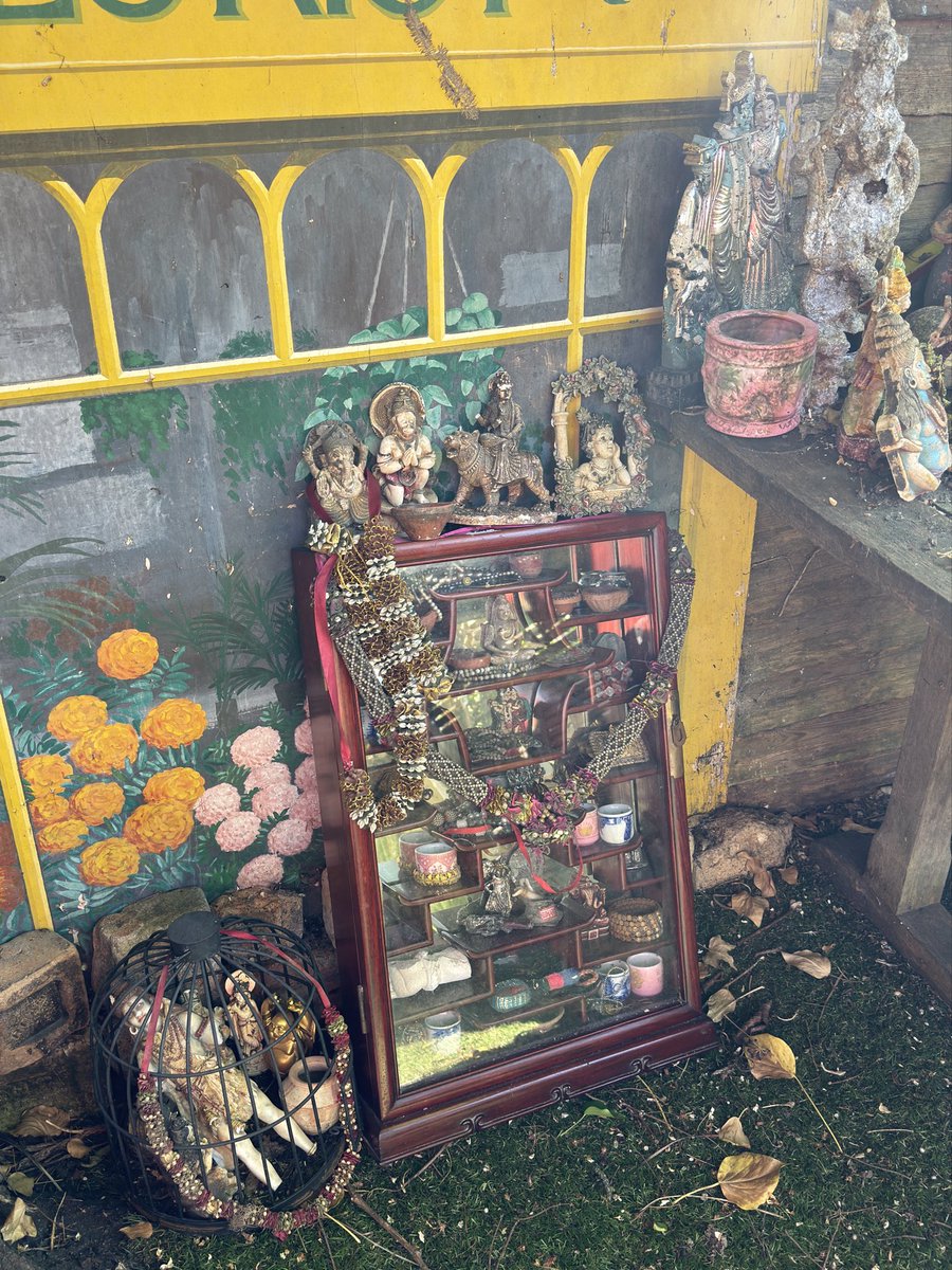 Stage one of my garden #shrine of #Hindu and #Buddhist rescued #river and #canal offerings ... the cabinet has glass in the back which means it's hard to see the tiny objects inside... big offerings out of sight on right) #mudlarking #thames