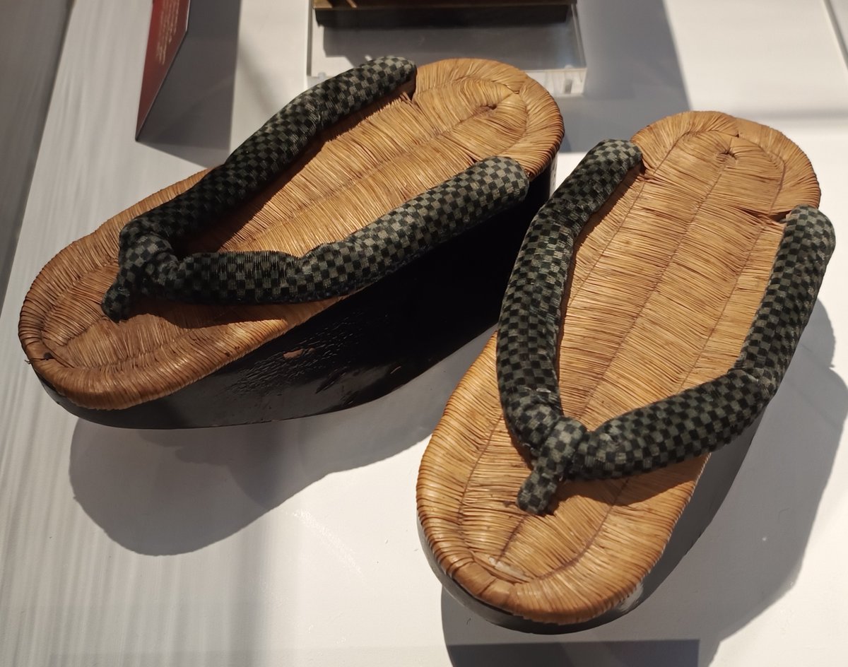 #ObjectOfTheWeek: Sandals (geta) This traditional Japanese footwear, on display in our Explorers gallery, resembles both clogs and flip-flops. The elevated wooden base helps keep the foot well above the ground. They could be worn to keep the feet dry and were worn by #Geisha.